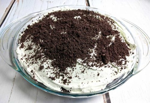 This scrumptiously super EASY no bake grasshopper pie is so light and fluffy – full of delicious Cool Whip, cream cheese, Oreos and Crème de Menthe! With a smooth minty chocolate-y taste, folks will ask for seconds. Think mint chocolate chip ice cream!