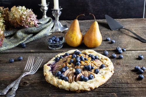 overhead shot of rustic pear and blueberry galette