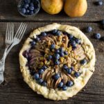 overhead shot of rustic pear and blueberry galette