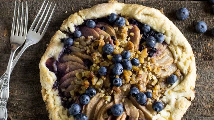 overhead shot of rustic pear and blueberry galette