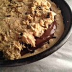 showing the layers of the chocolate chip skillet cookie stuffed with nutella spread