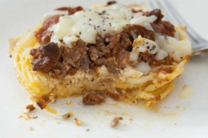 closeup of partly eat mini spaghetti pie casserole