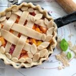 You will love this Homemade Peach Mango Sangria Skillet Pie, full of everything you put in Sangria, it's a burst of summertime right in your mouth.