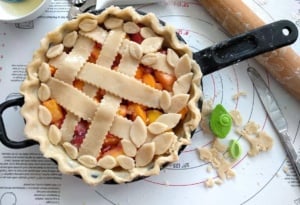 You will love this Homemade Peach Mango Sangria Skillet Pie, full of everything you put in Sangria, it's a burst of summertime right in your mouth.