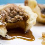 An awesome family favorite, Homemade Butter tarts are the number 1 tart in our family! This recipe is so easy and freezes well so you can double the batch! Only three ingredients to mix up and bake in that delicious buttery pie crust. Yum!