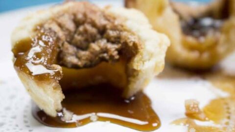 An awesome family favorite, Homemade Butter tarts are the number 1 tart in our family! This recipe is so easy and freezes well so you can double the batch! Only three ingredients to mix up and bake in that delicious buttery pie crust. Yum!