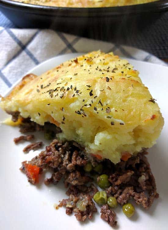 A family favorite, this Easy Homemade Shepherd’s Pie recipe is the ultimate comfort food that can feed an army, or be perfect for lunch time leftovers. It’s really just a casserole with layers of ground beef, vegetables and creamy mashed potatoes.