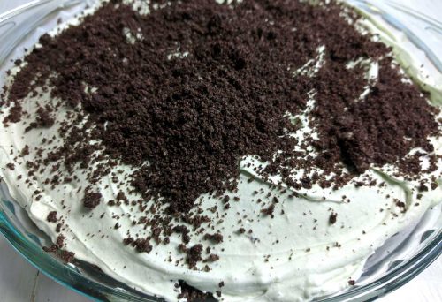 Closeup photo of super easy no bake grasshopper pie in glass pie plate