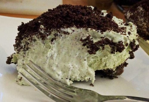 This scrumptiously super EASY no bake grasshopper pie is so light and fluffy – full of delicious Cool Whip, cream cheese, Oreos and Crème de Menthe! With a smooth minty chocolate-y taste, folks will ask for seconds. Think mint chocolate chip ice cream!