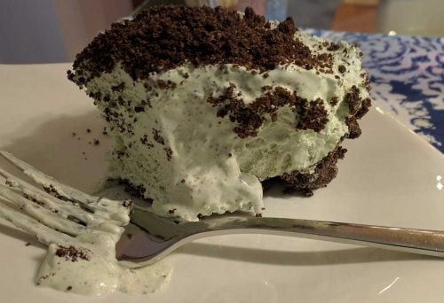 This scrumptiously super EASY no bake grasshopper pie is so light and fluffy – full of delicious Cool Whip, cream cheese, Oreos and Crème de Menthe! With a smooth minty chocolate-y taste, folks will ask for seconds. Think mint chocolate chip ice cream!