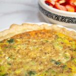 broccoli quiche ready to serve with fruit salad