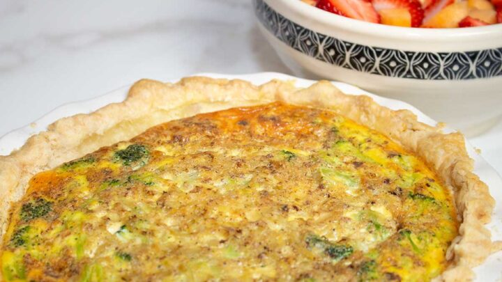 broccoli quiche ready to serve with fruit salad