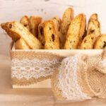 biscotti standing in a small box with a jute and lace ribbon