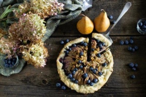overhead shot of rustic pear and blueberry galette