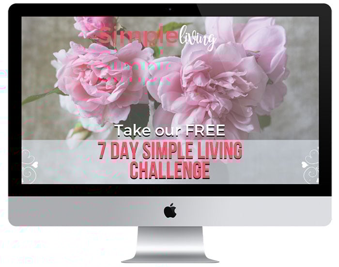 mac computer with 7 day simple living challenge and peonies in a vase in background