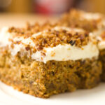 carrot cake recipe with cream cheese and toasted pecans on top