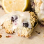 blueberry scone with lemon glaze and sliced lemon in background