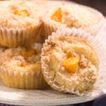 stack of baked cobbler muffins with peaches