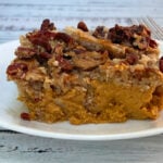 easy pumpkin pie crunch cake on white plate