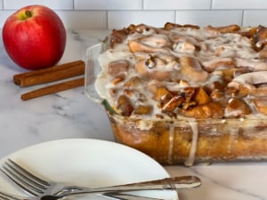 coffee cake with glaze and a plate for serving