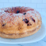 sour cherry cake recipe on a white pie plate