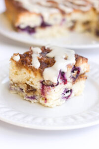 piece of blueberry coffee cake on a white plate