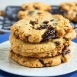 A stack of chocolate chip cookies on a plate.