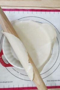 A rolling pin and a rolling pin on a baking sheet.