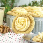 Gingerbread cookies on a plate with a glass of milk.