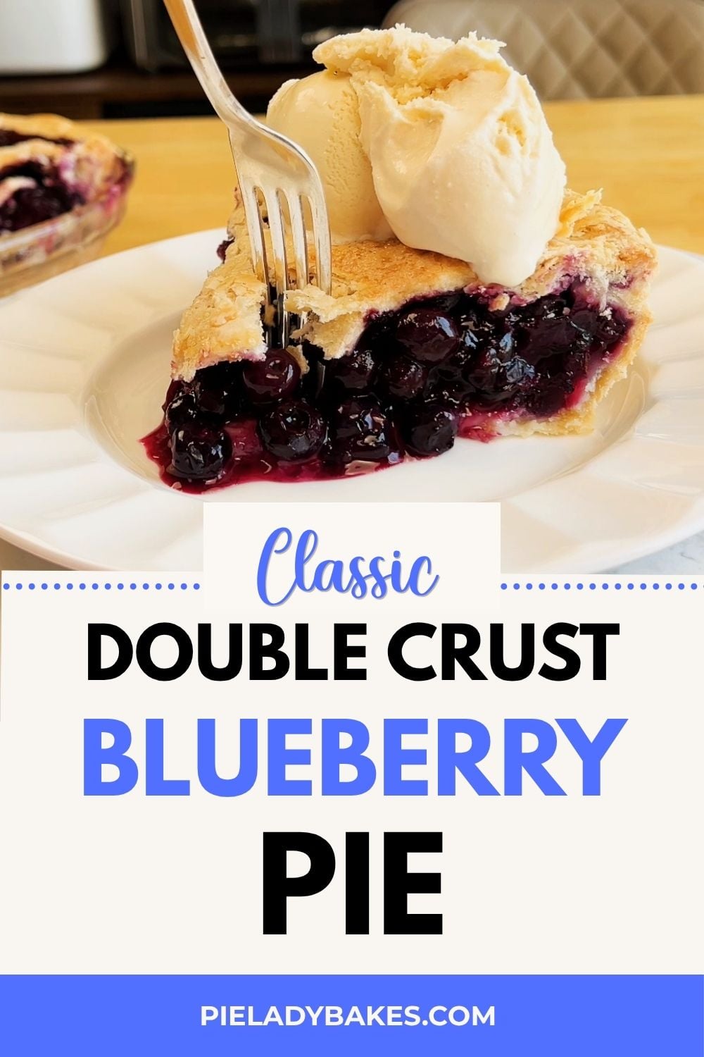 A slice of blueberry pie with double crust and a scoop of vanilla ice cream on top, served on a white plate with a fork.